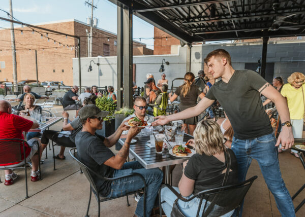 people gathered outside on a patio