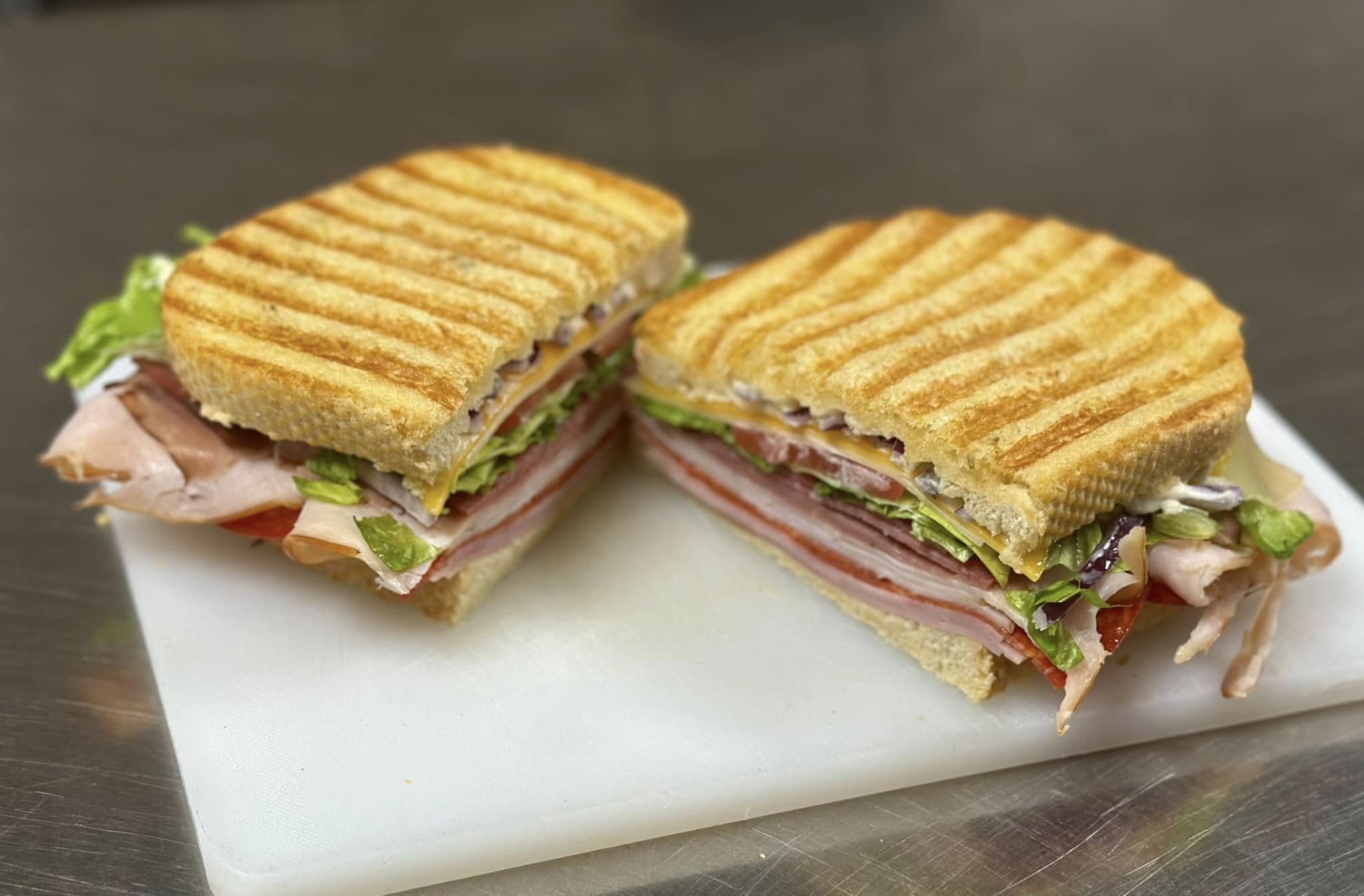 italian panini freshly cut on a cutting board