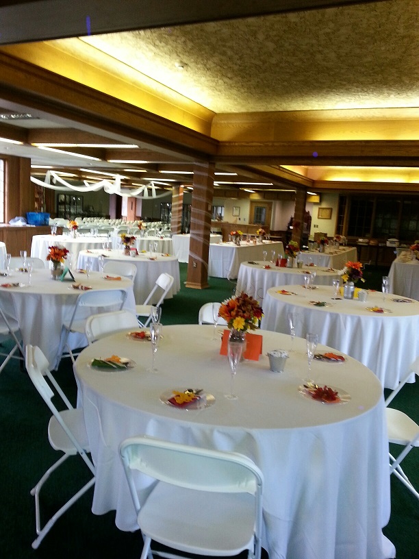 room filled with white round tables and table decor at the Wagnalls memorial