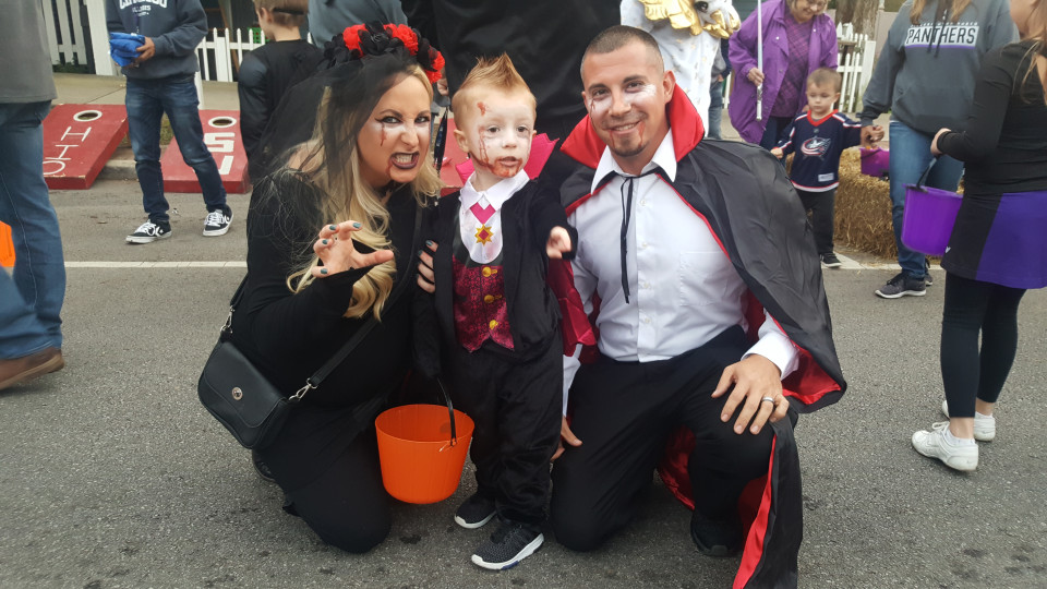 haunted village in Pickerington Ohio, a couple and their son dressed as vampires and posing for a photo