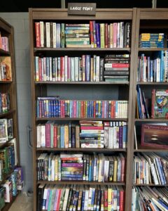 books displayed in a bookshelf stacked