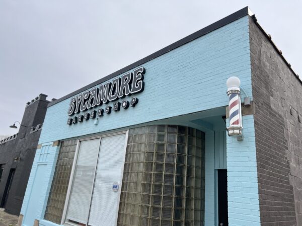 exterior of an experimental barbershop teal