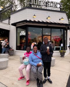 family standing in front of johnson's real ice cream shop