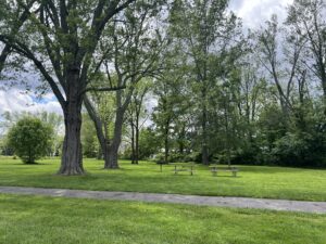 park with picnic tables and a grill