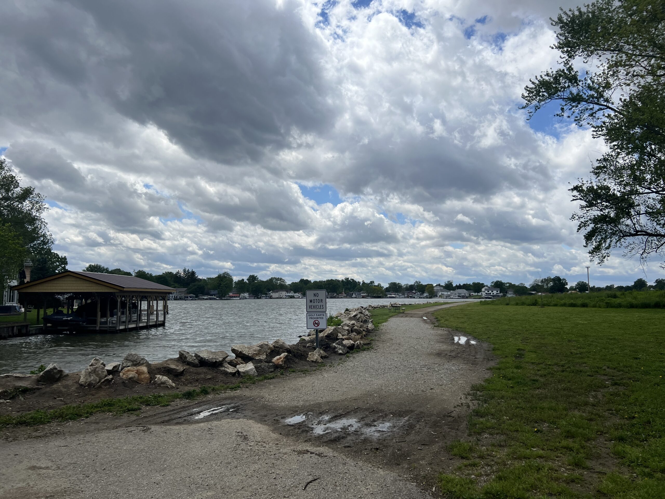 walking path along the lake at a park