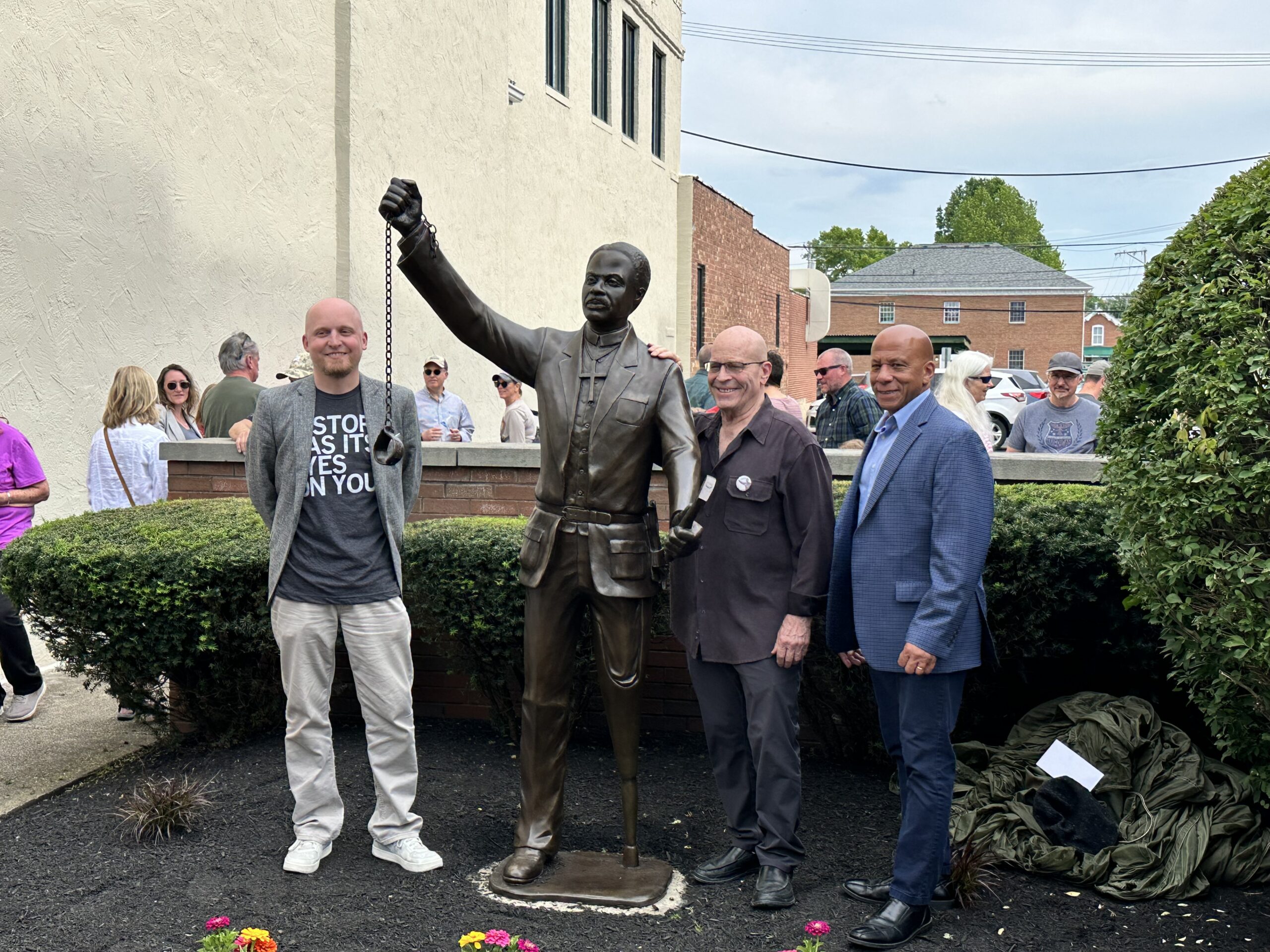 statue with people gathered around it