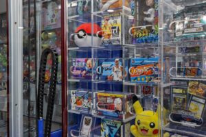 Cards on 6th Hobby Shop interior located in Lancaster Ohio in Fairfield County, game machine with Pokémon prizes
