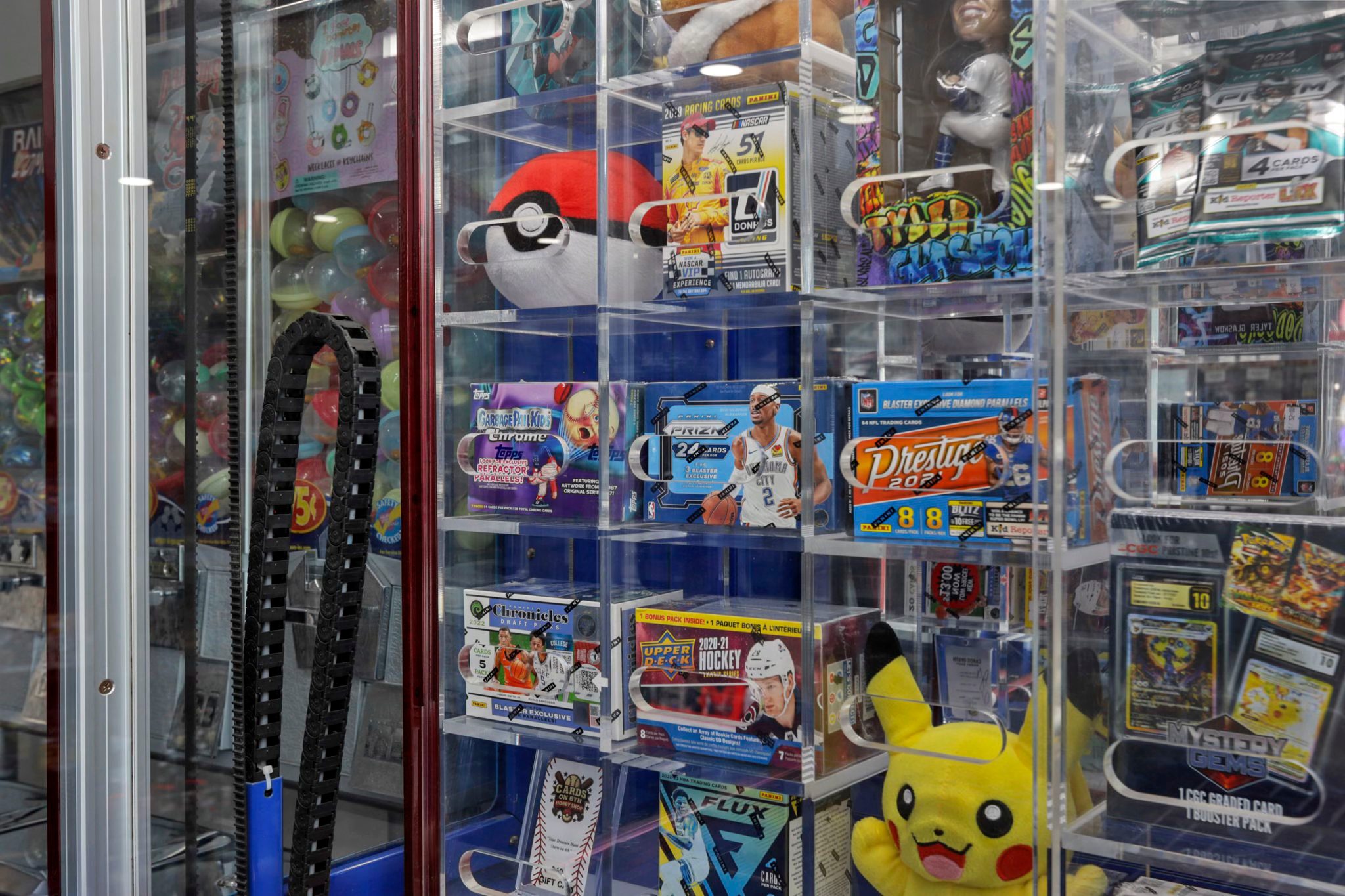 Cards on 6th Hobby Shop interior located in Lancaster Ohio in Fairfield County, game machine with Pokémon prizes