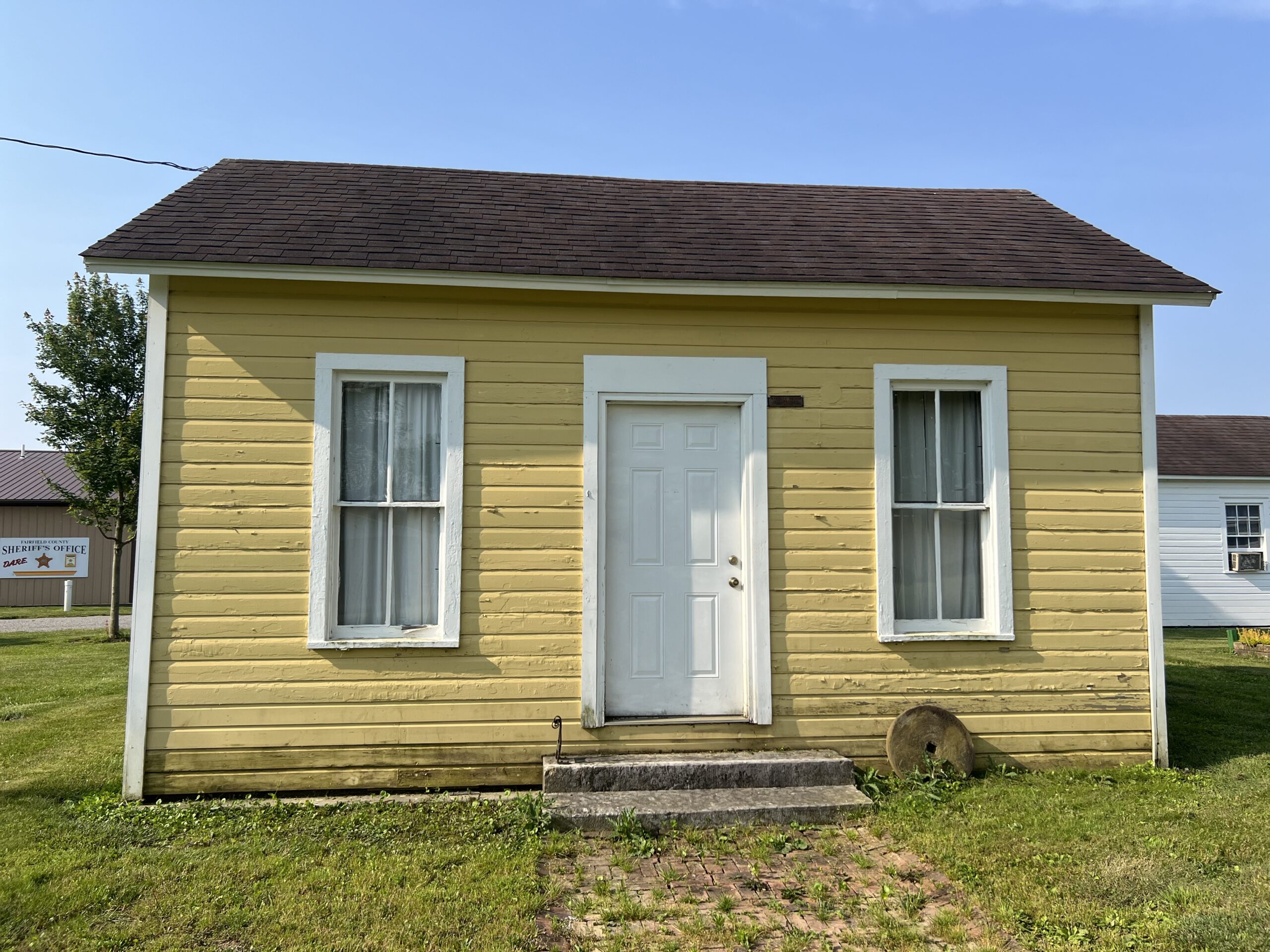 historic yellow home in the Millersport Heritage Village