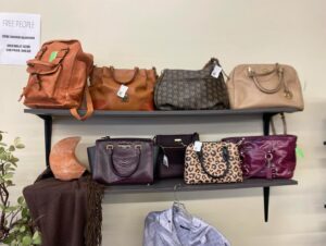 purses on the wall at all saints consignment in lancaster ohio