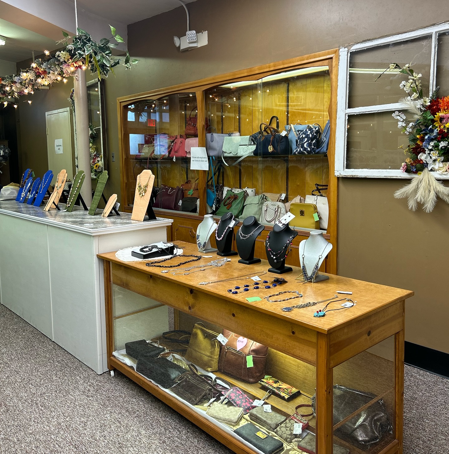 jewelry and other clothing items on display for all saints consignment in lancaster ohio