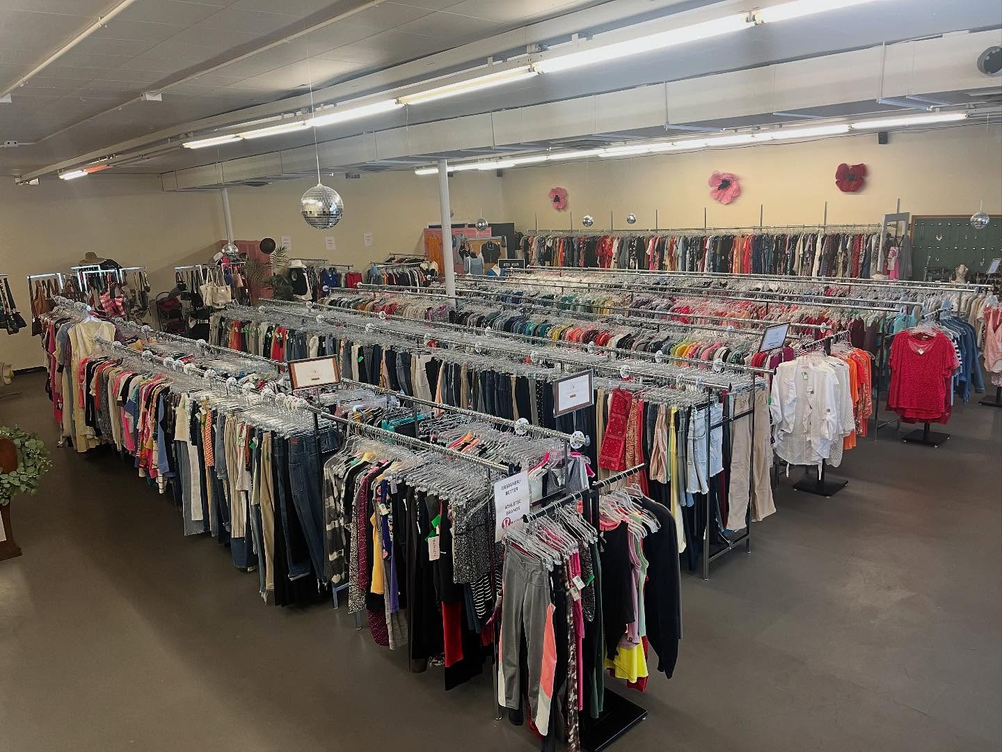 dresses and other clothing items on display for all saints consignment in lancaster ohio