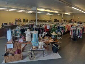 dresses and other clothing items on display for all saints consignment in lancaster ohio