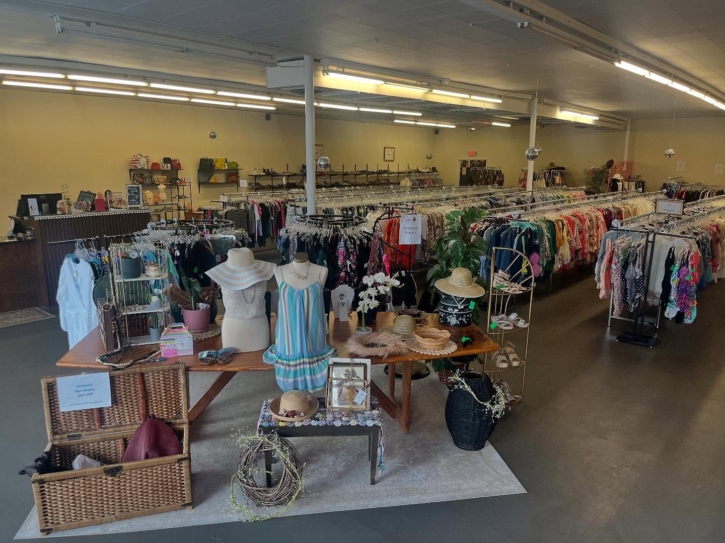 dresses and other clothing items on display for all saints consignment in lancaster ohio