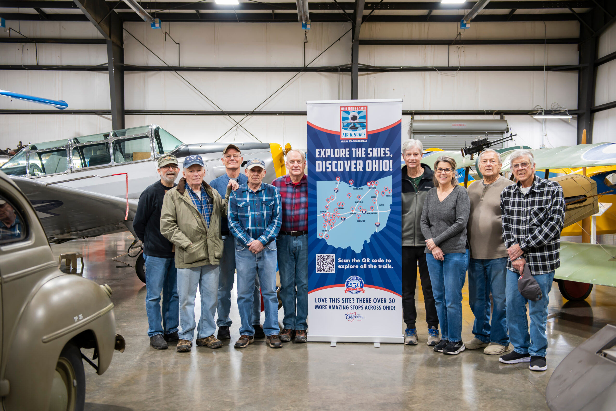 historic Aircraft Squadron members historic Aircraft Squadron members posing in front of the america 250 ohio sign