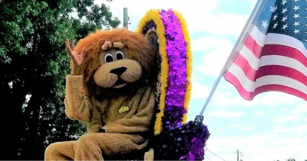 lion mascot on top of a parade float for pickerington Labor Day festival and parade