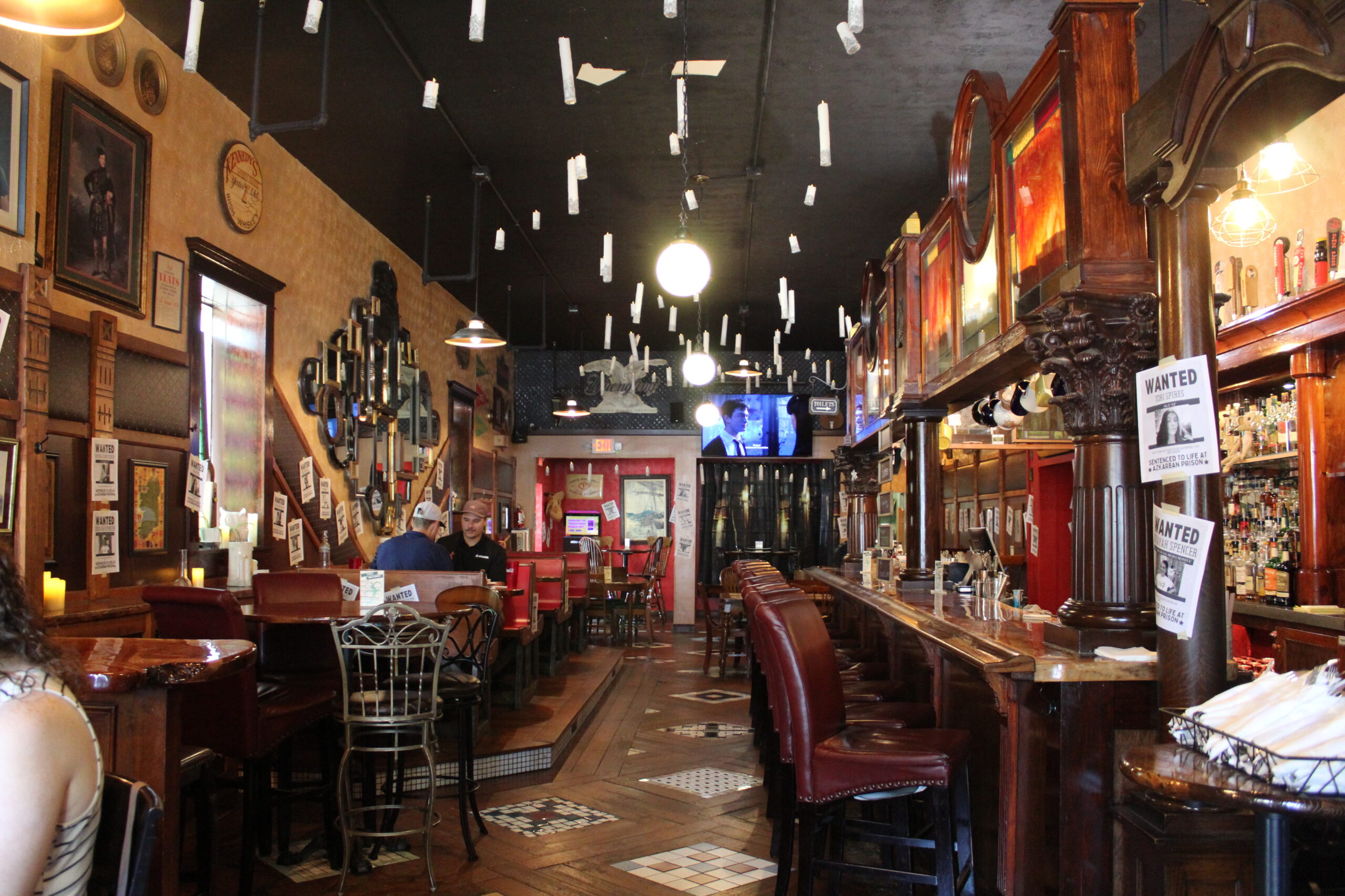 pub decorated with floating candles and wizardly themed items