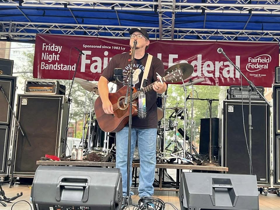 Photo of musician Matt Willaman on a stage