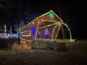 covered bridge decorated and lighted for christmas