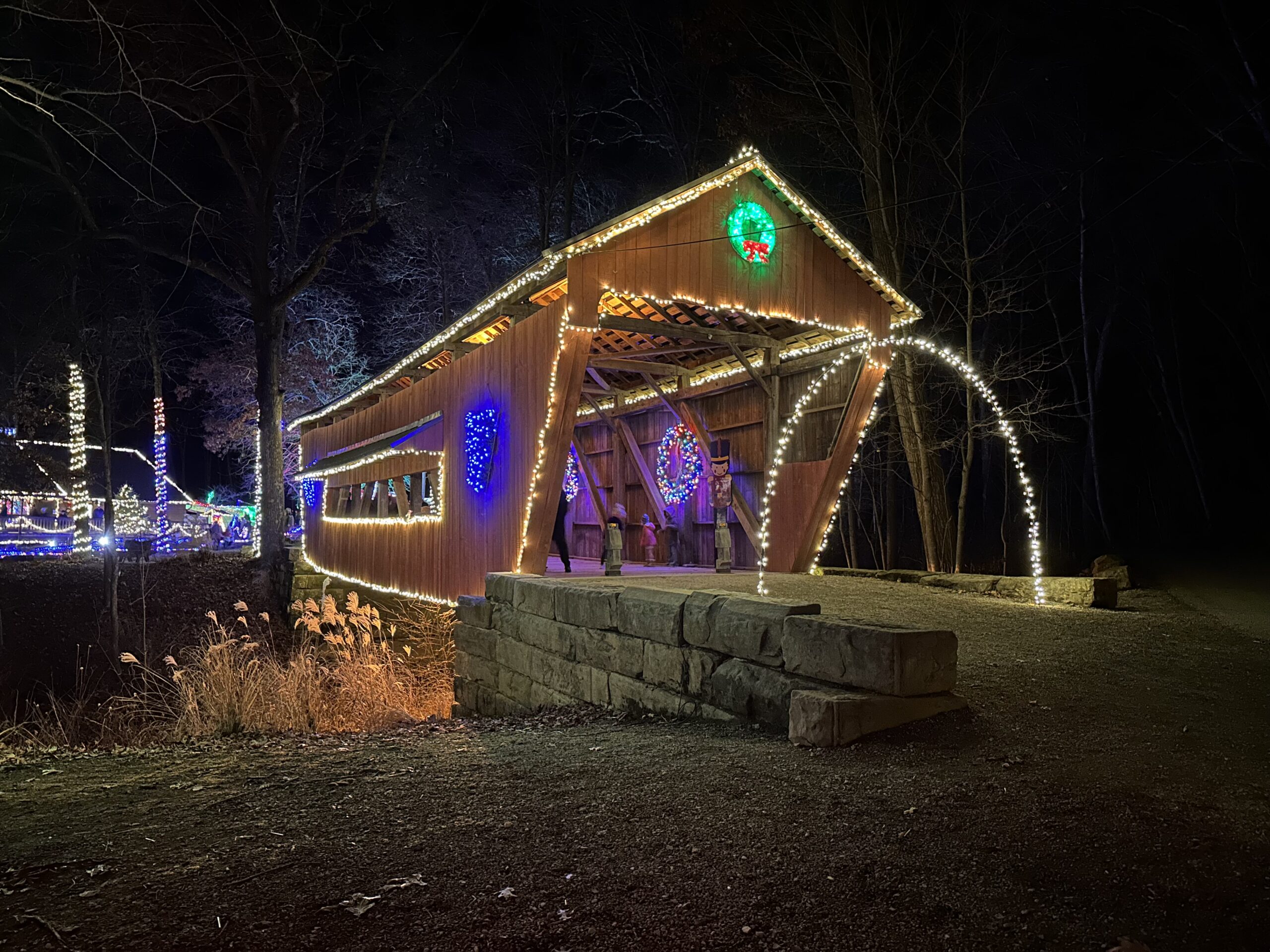 covered bridge decorated and lighted for christmas