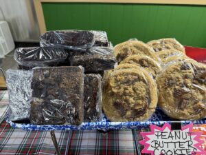 jojos pizza , wrapped cookies and brownies on display