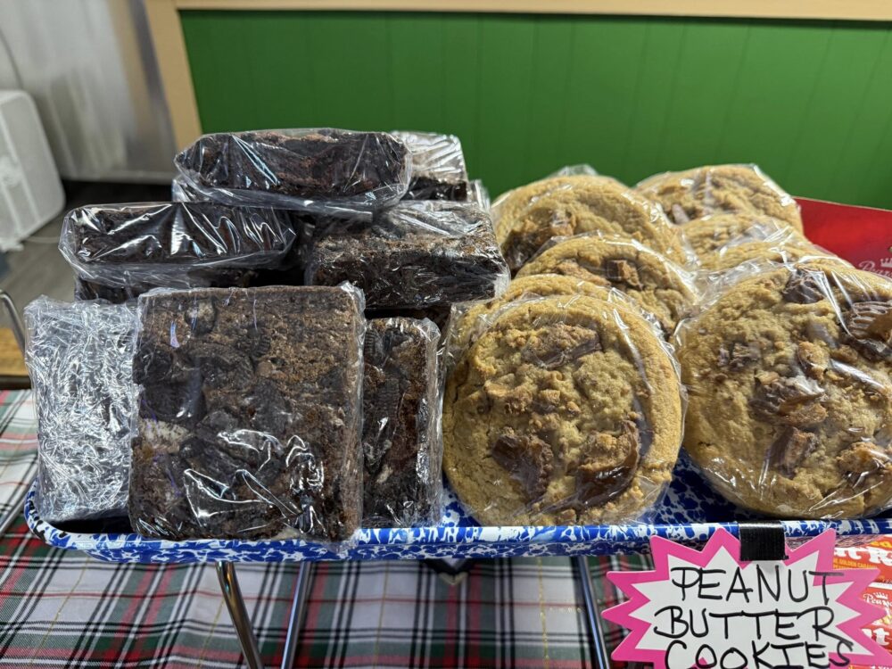jojos pizza , wrapped cookies and brownies on display