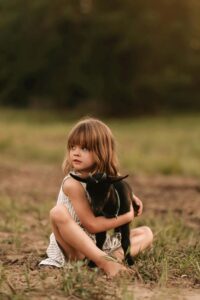 Photo of a child with a goat at Buckeye Ridge Rescue & Retreat